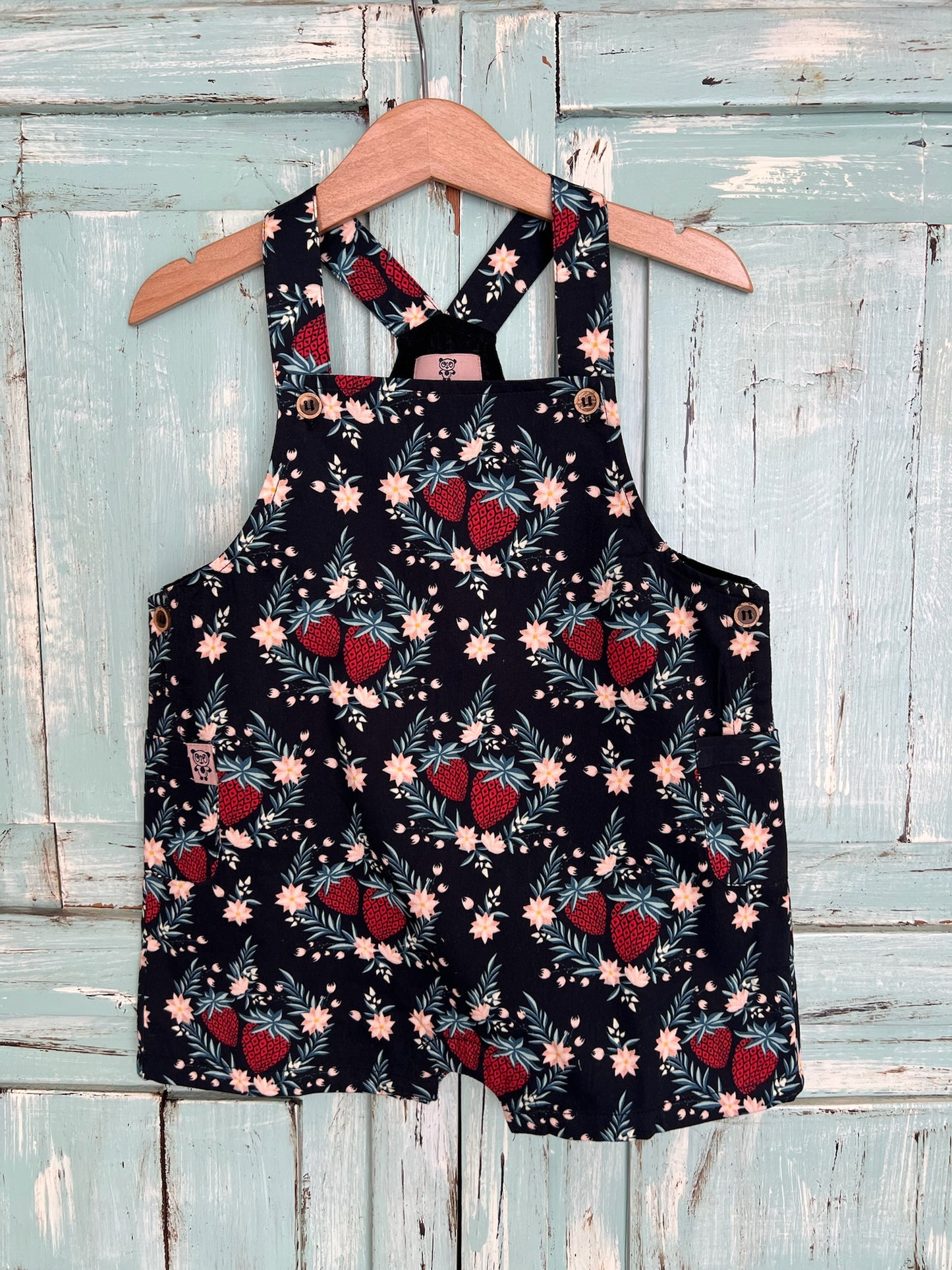 organic cotton floral print romper for babies 9-18 months old, soft, breathable, and made from sustainable materials. featuring snap buttons for easy diaper change. Grow with the kid.Inside linen for added comfort on baby delicate skin