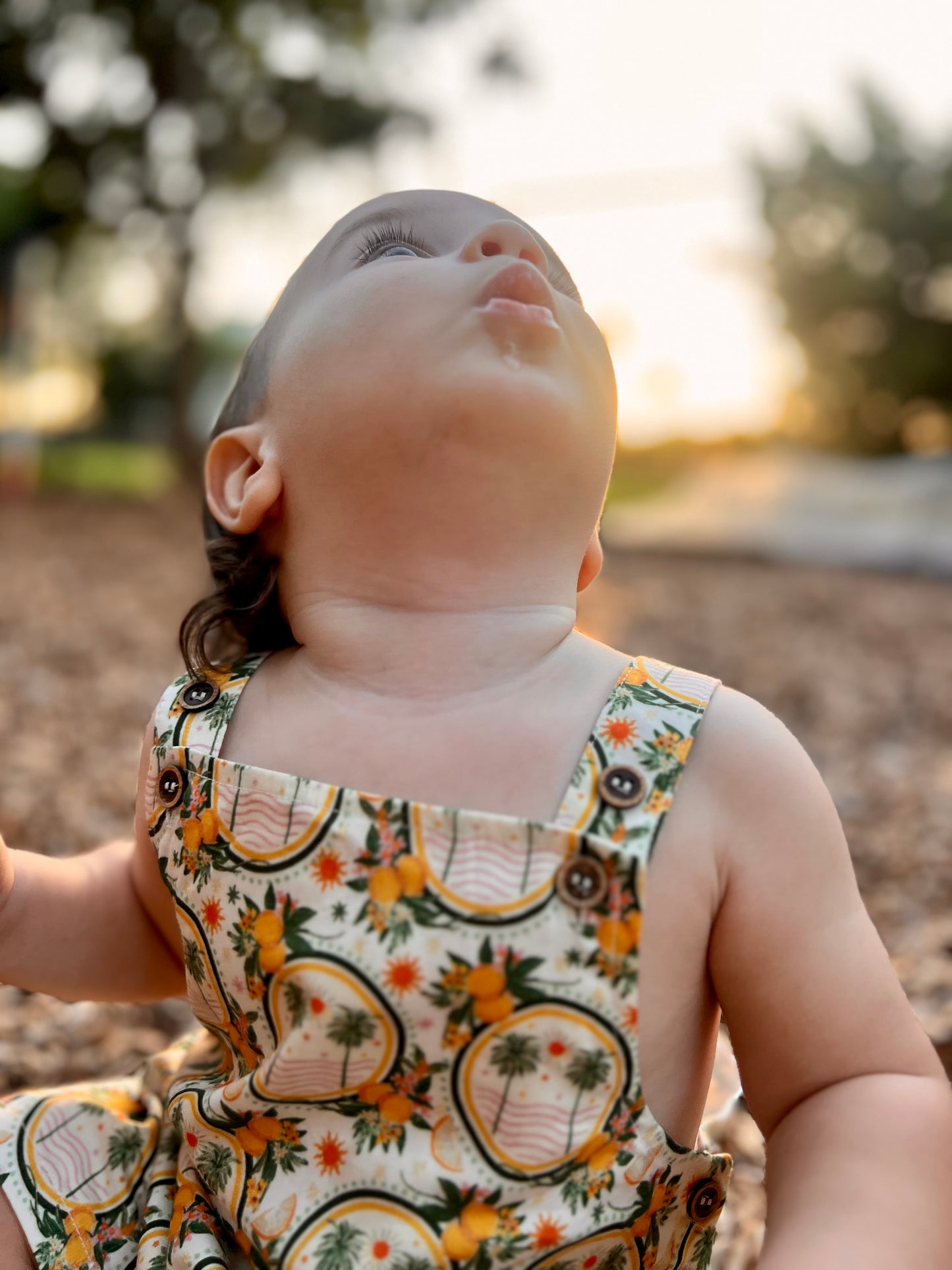 Lucy romper in palms