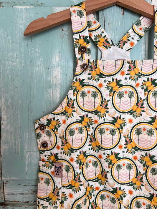 organic cotton floral print romper for babies 9-18 months old, soft, breathable, and made from sustainable materials. featuring snap buttons for easy diaper change. Grow with the kid.Inside linen for added comfort on baby delicate skin