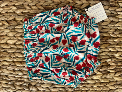 organic cotton baby bloomers with pomegranate print. designed for 9 to 12 and 12 to 18 months old babies. soft, breathable, and eco-friendly with a playful fruit-theme pattern